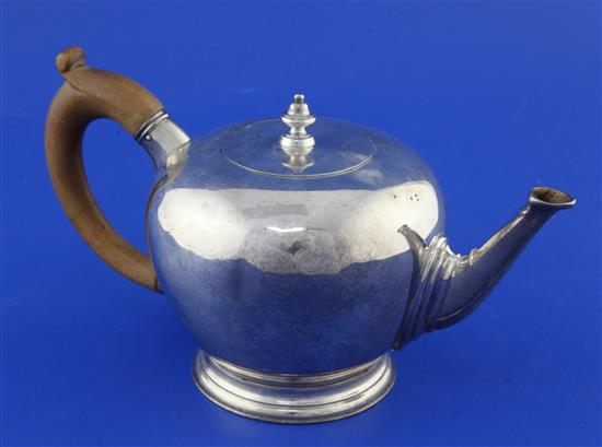 A 1930s 18th century style silver bullet shaped teapot, gross 14.5 oz.